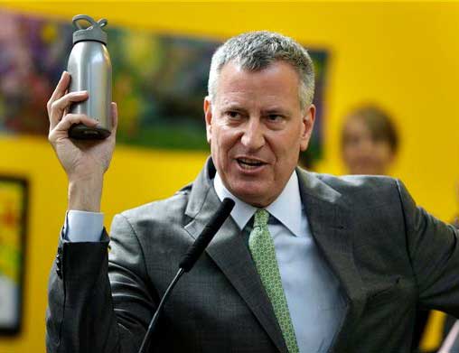 NYC Mayor Bill De Blasio holds up a reusable water bottle