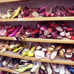 Cluttered Shoes on Closet Shelves