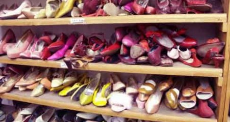 Cluttered Shoes on Closet Shelves